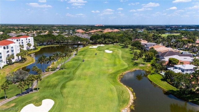 bird's eye view featuring view of golf course, a water view, and a residential view