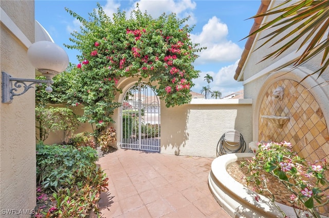 172 Via Napoli, Naples, FL 34105 - view of patio / terrace featuring a gate and fence