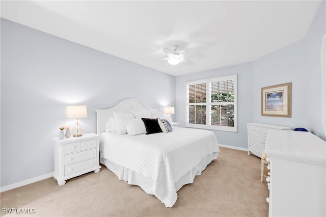 172 Via Napoli, Naples, FL 34105 - bedroom featuring light carpet, baseboards, and a ceiling fan