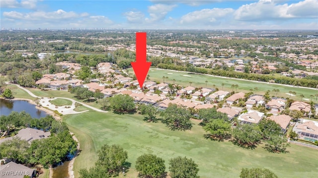 bird's eye view with a residential view, view of golf course, and a water view
