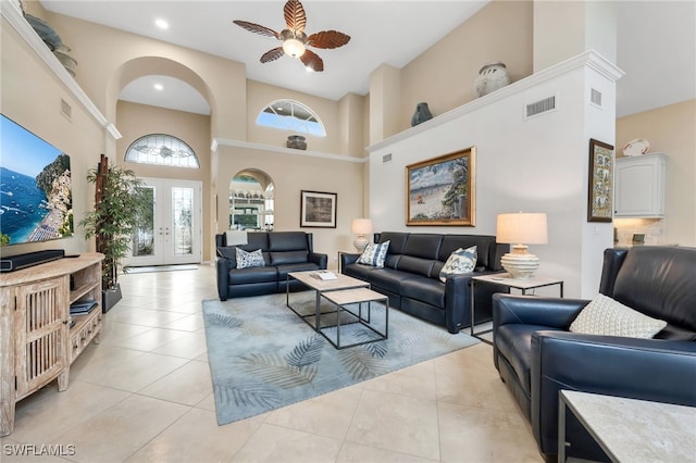 172 Via Napoli, Naples, FL 34105 - living room featuring a towering ceiling, a ceiling fan, arched walkways, light tile patterned floors, and recessed lighting