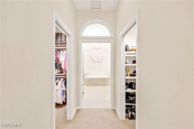 172 Via Napoli, Naples, FL 34105 - hall featuring light colored carpet and light tile patterned floors