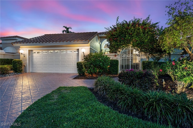172 Via Napoli, Naples, FL 34105 - view of front of property featuring driveway, a tile roof, stucco siding, and an attached garage