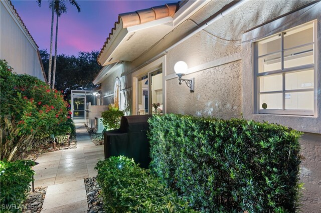 172 Via Napoli, Naples, FL 34105 - view of side of home featuring stucco siding