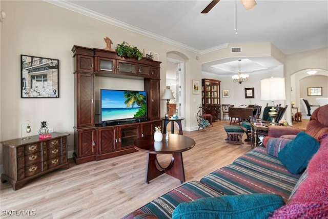 10644 Pelican Preserve Blvd # 101, Fort Myers, FL 33913 - living area with crown molding, ceiling fan with notable chandelier, arched walkways, light wood finished floors, and visible vents