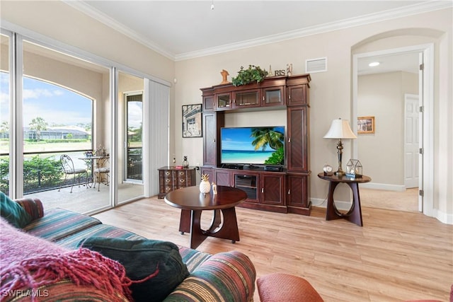 10644 Pelican Preserve Blvd # 101, Fort Myers, FL 33913 - living room with baseboards, visible vents, crown molding, and light wood finished floors