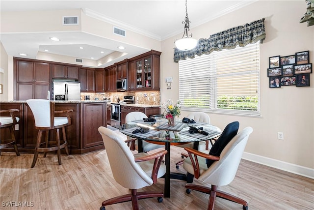 10644 Pelican Preserve Blvd # 101, Fort Myers, FL 33913 - dining room featuring baseboards, visible vents, crown molding, and light wood-type flooring