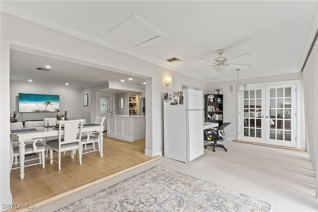 interior space with ceiling fan, visible vents, french doors, and crown molding