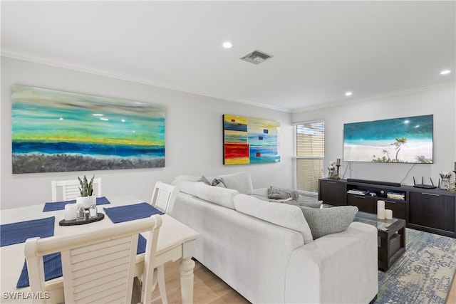 living area featuring visible vents, recessed lighting, crown molding, and wood finished floors