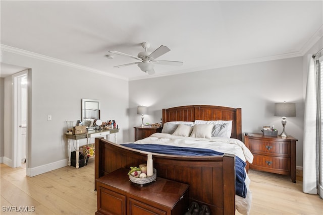 bedroom featuring crown molding, light wood-style floors, and baseboards