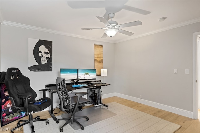 home office featuring baseboards, crown molding, wood finished floors, and a ceiling fan
