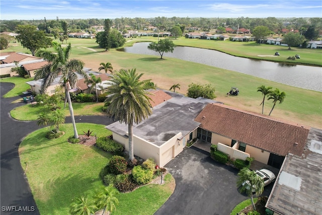 birds eye view of property with a residential view and a water view