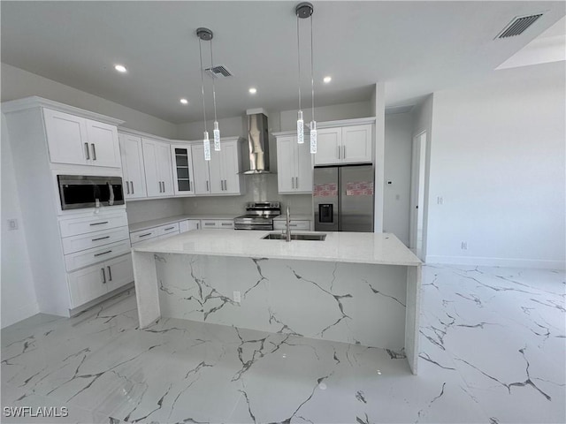 1173 Ebers St E, Lehigh Acres, FL 33974 - kitchen featuring visible vents, wall chimney exhaust hood, a spacious island, and stainless steel appliances