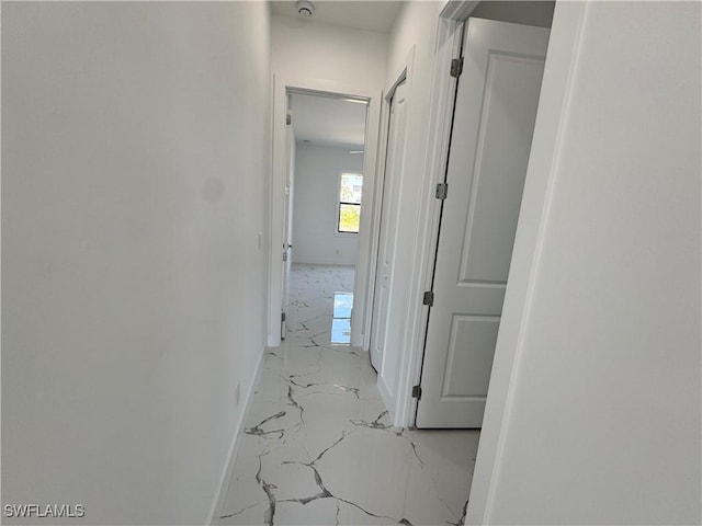 1173 Ebers St E, Lehigh Acres, FL 33974 - corridor with marble finish floor and baseboards