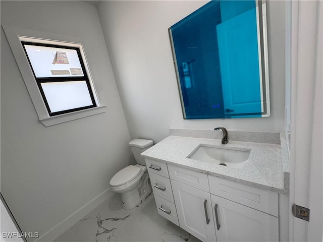 1173 Ebers St E, Lehigh Acres, FL 33974 - bathroom with toilet, marble finish floor, vanity, and baseboards
