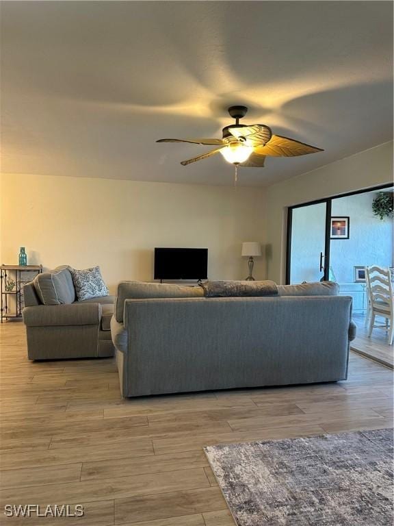 4244 SE 20th Pl Unit 218, Cape Coral, FL 33904 - living room with ceiling fan and light wood-style floors