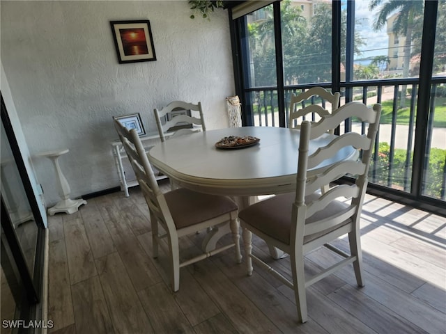 4244 SE 20th Pl Unit 218, Cape Coral, FL 33904 - dining area with a textured wall and hardwood / wood-style floors