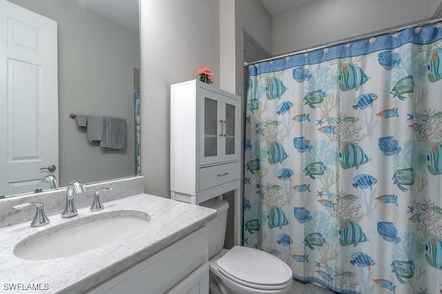 14566 Tropical Dr, Naples, FL 34114 - bathroom with toilet, a shower with shower curtain, and vanity