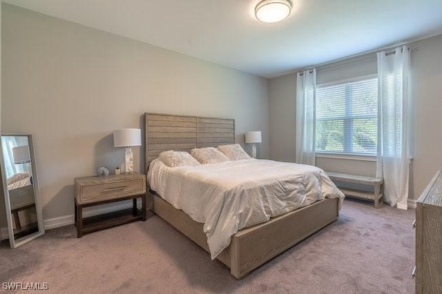 14566 Tropical Dr, Naples, FL 34114 - bedroom featuring baseboards and carpet
