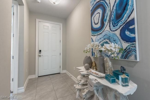 14566 Tropical Dr, Naples, FL 34114 - entrance foyer with tile patterned floors and baseboards