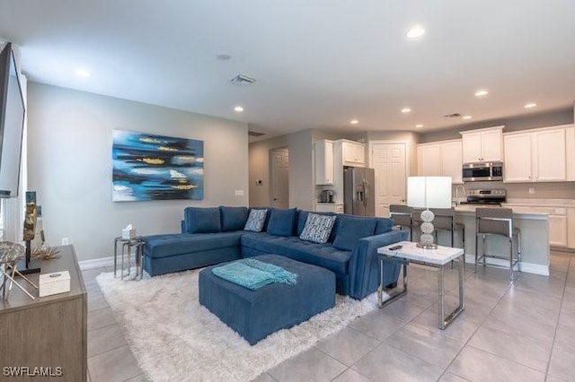 14566 Tropical Dr, Naples, FL 34114 - living area with light tile patterned floors, baseboards, and recessed lighting