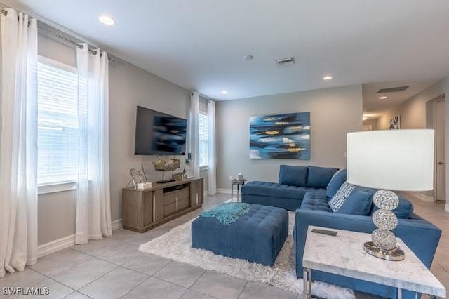 14566 Tropical Dr, Naples, FL 34114 - living room featuring baseboards, visible vents, and recessed lighting