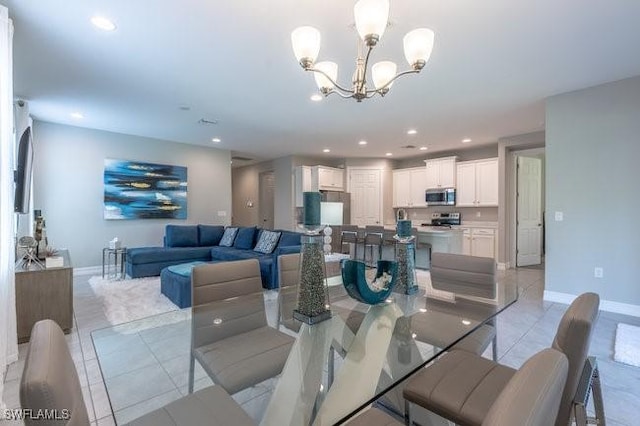 14566 Tropical Dr, Naples, FL 34114 - dining room featuring light tile patterned floors, a notable chandelier, baseboards, and recessed lighting