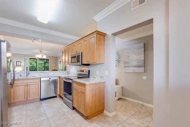 8251 Pathfinder Loop Unit 615, Fort Myers, FL 33919 - kitchen featuring stainless steel appliances, ornamental molding, light tile patterned floors, and light stone countertops