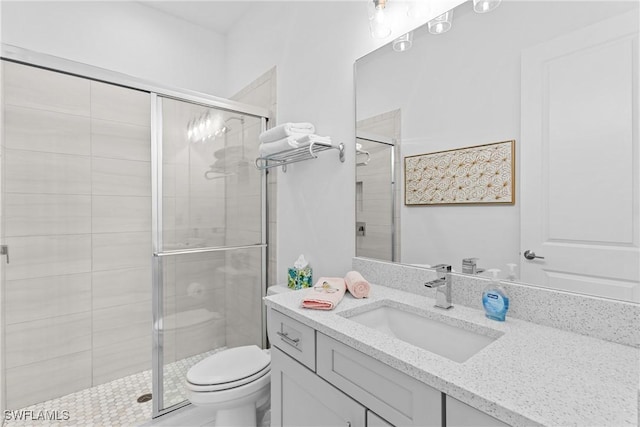 9336 Montelanico Loop, Naples, FL 34119 - bathroom with a stall shower, toilet, and vanity