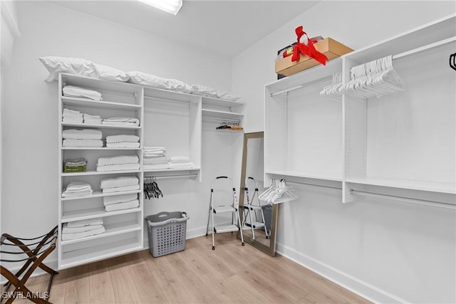 spacious closet with wood finished floors