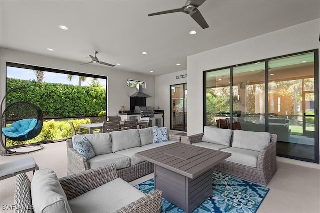 carpeted living area featuring recessed lighting and ceiling fan