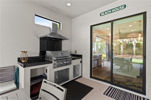 view of patio / terrace with a sink, area for grilling, and a grill