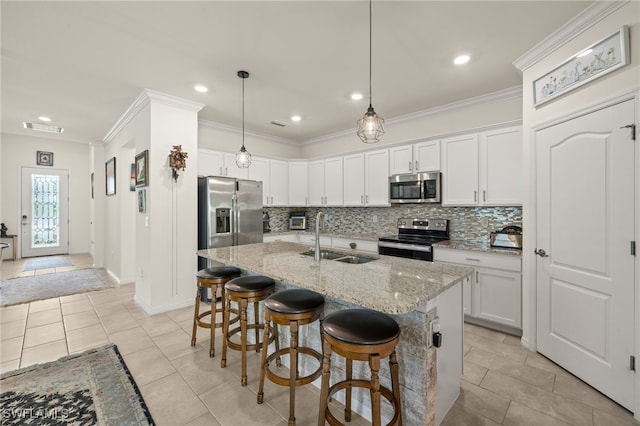 3657 Crimson Ln, Fort Myers, FL 33916 - kitchen featuring stainless steel appliances, a sink, backsplash, crown molding, and a kitchen breakfast bar