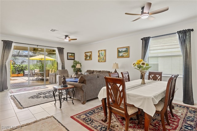 3657 Crimson Ln, Fort Myers, FL 33916 - dining area with ceiling fan, crown molding, and light tile patterned flooring