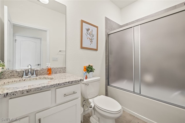 3657 Crimson Ln, Fort Myers, FL 33916 - bathroom with vanity, toilet, shower / bath combination with glass door, and tile patterned floors