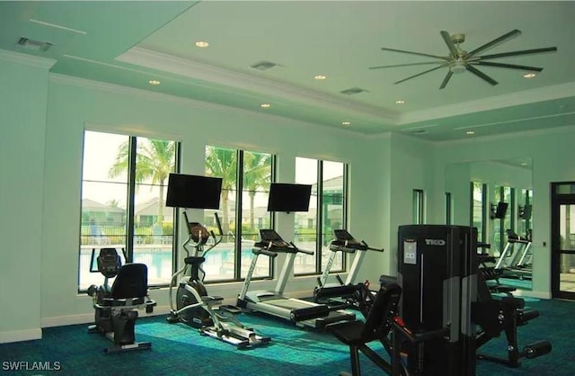 3657 Crimson Ln, Fort Myers, FL 33916 - workout area with ornamental molding, plenty of natural light, a ceiling fan, and a tray ceiling