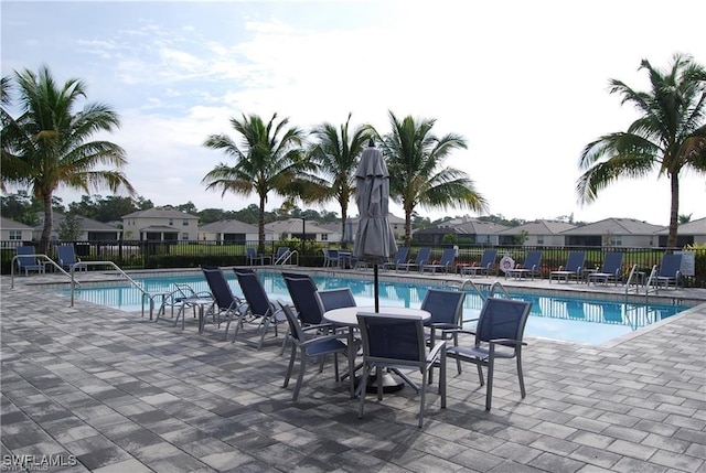 3657 Crimson Ln, Fort Myers, FL 33916 - community pool featuring a patio and a residential view