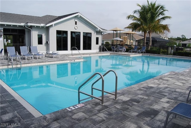 3657 Crimson Ln, Fort Myers, FL 33916 - community pool featuring a patio and a sink