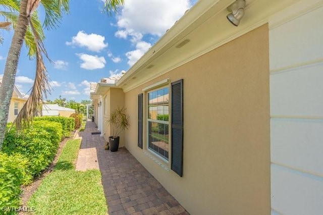 7857 Umberto Ct, Naples, FL 34114 - view of property exterior featuring stucco siding