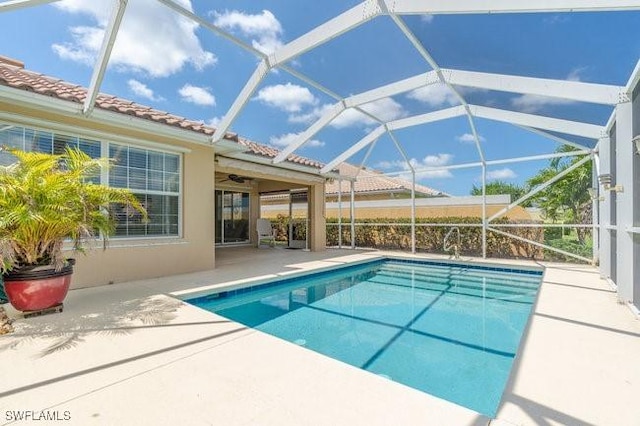 7857 Umberto Ct, Naples, FL 34114 - outdoor pool featuring glass enclosure, a patio, and ceiling fan