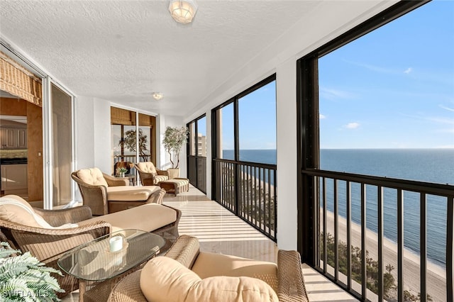 8171 Bay Colony Dr Unit 1902, Naples, FL 34108 - sunroom / solarium featuring a water view and a textured ceiling