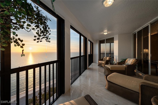 8171 Bay Colony Dr Unit 1902, Naples, FL 34108 - sunroom with a water view and a textured ceiling
