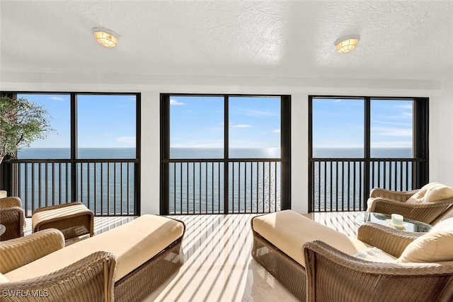 8171 Bay Colony Dr Unit 1902, Naples, FL 34108 - living room with a water view and a textured ceiling