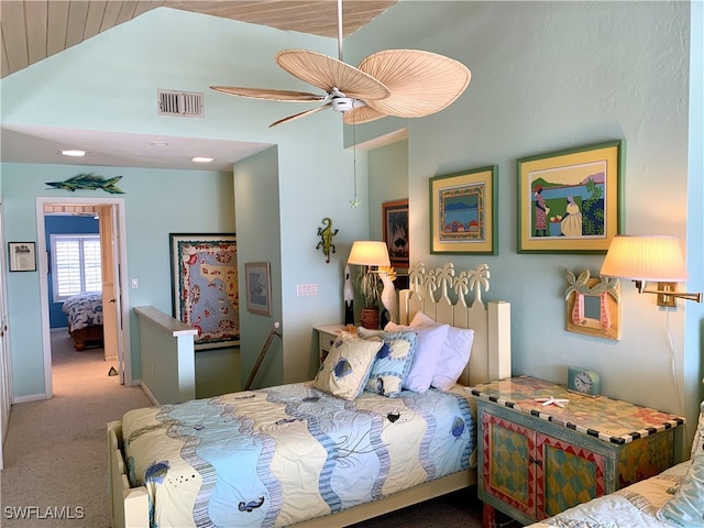 bedroom with carpet flooring, a ceiling fan, visible vents, and lofted ceiling