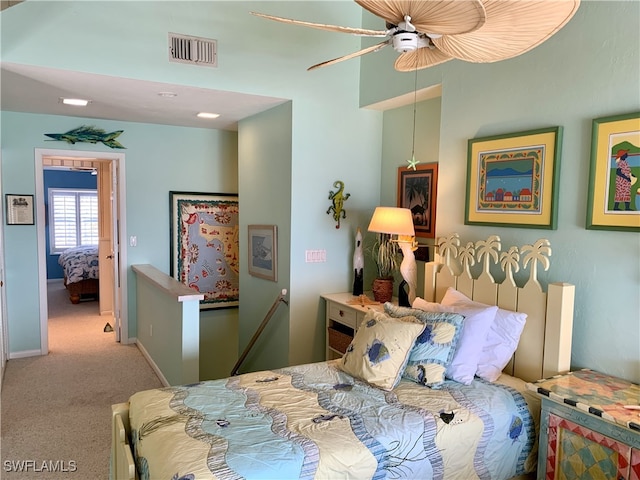 bedroom featuring visible vents, carpet flooring, baseboards, and a ceiling fan