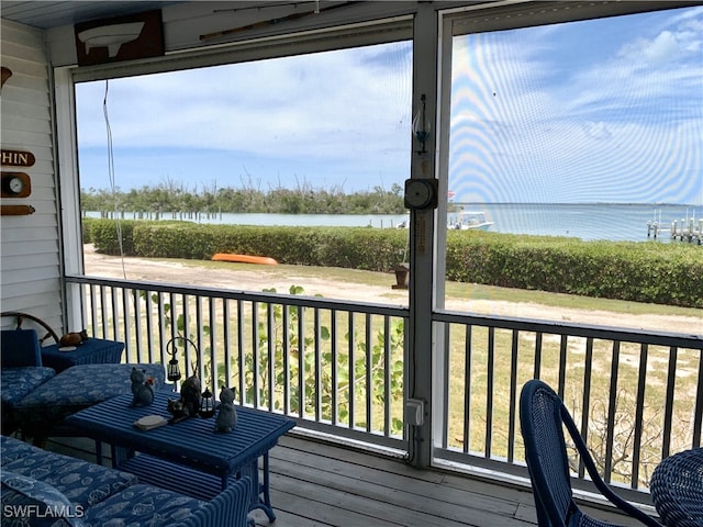 wooden terrace with a water view