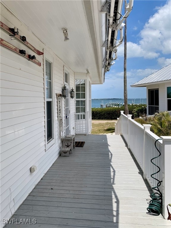 deck featuring a water view