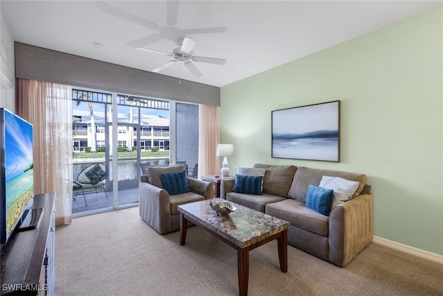 7920 Mahogany Run Ln Unit 1015, Naples, FL 34113 - living room featuring a ceiling fan, baseboards, and carpet