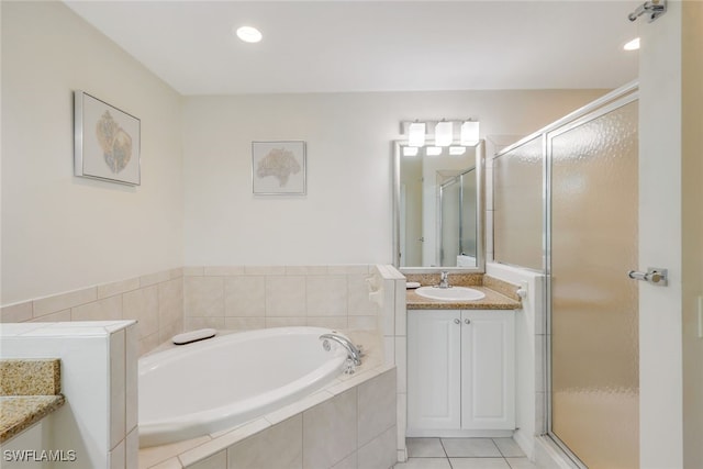 7920 Mahogany Run Ln Unit 1015, Naples, FL 34113 - full bath with vanity, a bath, a stall shower, and tile patterned flooring