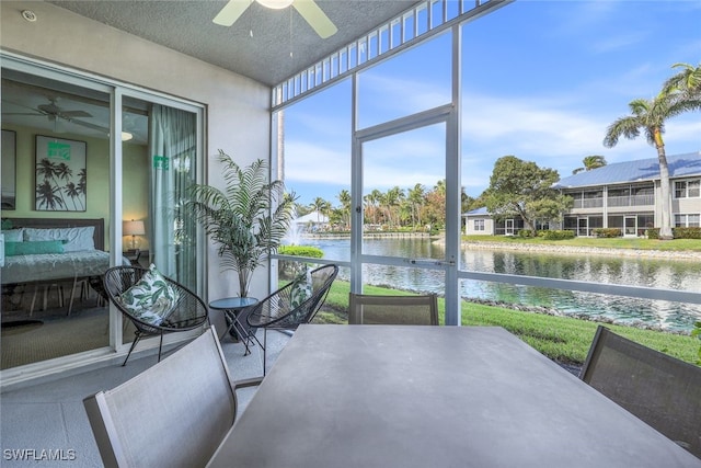 7920 Mahogany Run Ln Unit 1015, Naples, FL 34113 - sunroom featuring outdoor dining area, a water view, and ceiling fan